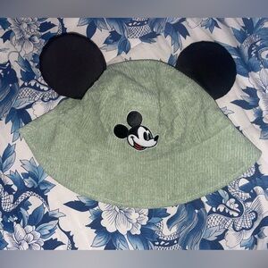 Sage green Mickey Mouse bucket hat with black ears.